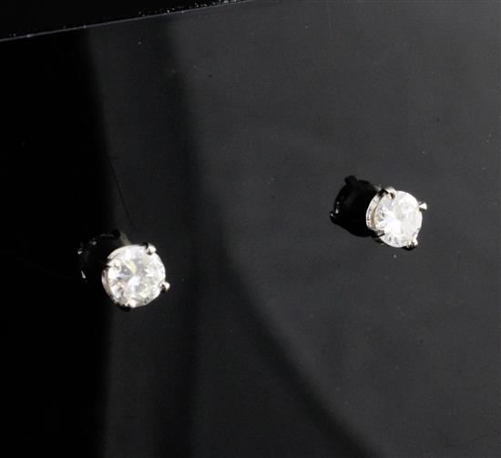 A pair of 18ct gold and solitaire diamond ear studs,